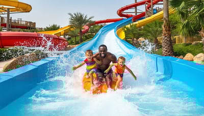 Family enjoying water slides at Water Park Dubai Family enjoying water slides at Water Park Dubai